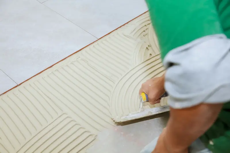 Workers are laying tiles